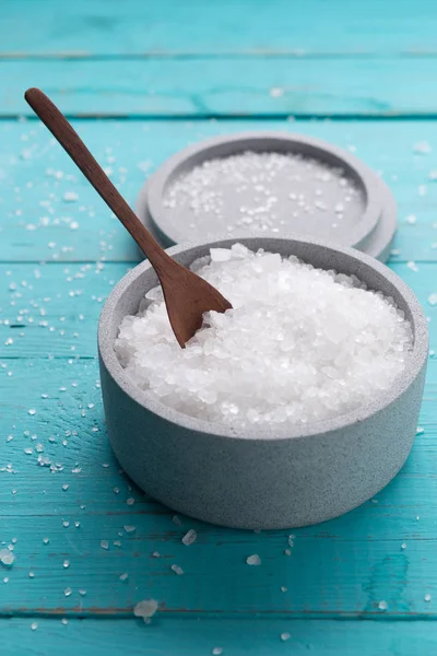 Sea salt on wooden background — Stock Photo, Image