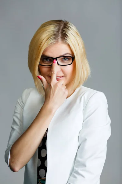 Beautiful young girl adjusts glasses — Stock Photo, Image