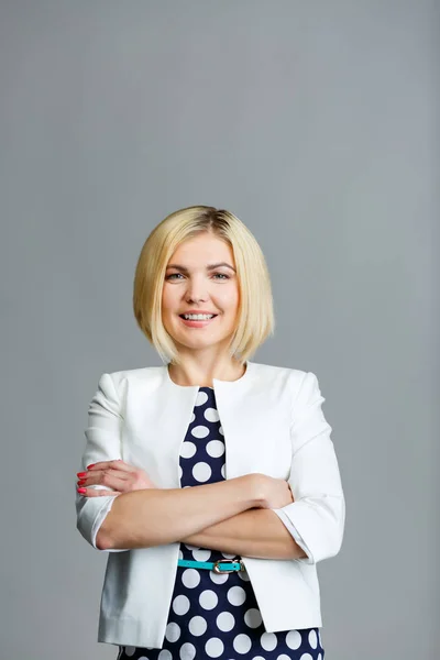 Beautiful blonde with arms crossed — Stock Photo, Image