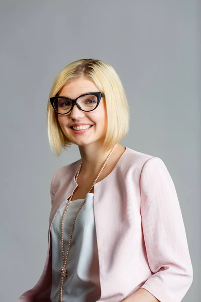 Smiling woman in black glasses — Stock Photo, Image