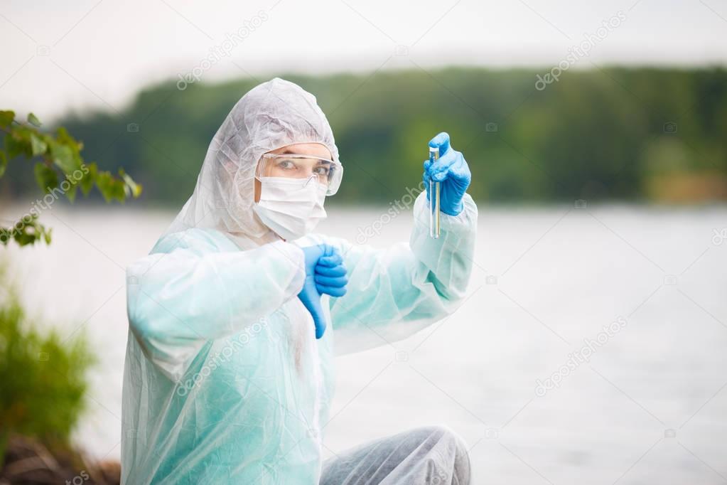 Ecologist with test-tube in mask