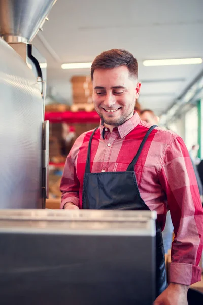 Photo of young businessman near roaster — Stock Photo, Image
