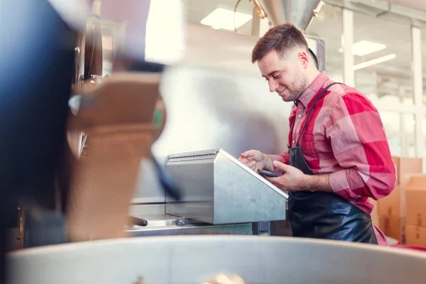 Image of businessman with phone at computer of industrial machine — Stock Photo, Image