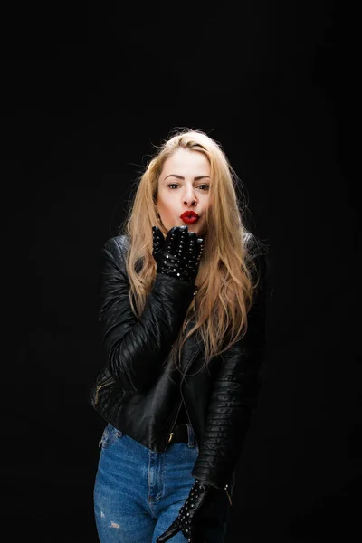 Photo of young blonde in leather jacket sending air kiss — Stock Photo, Image