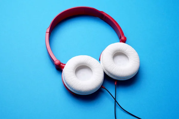 Photo of red with white headphones on top — Stock Photo, Image