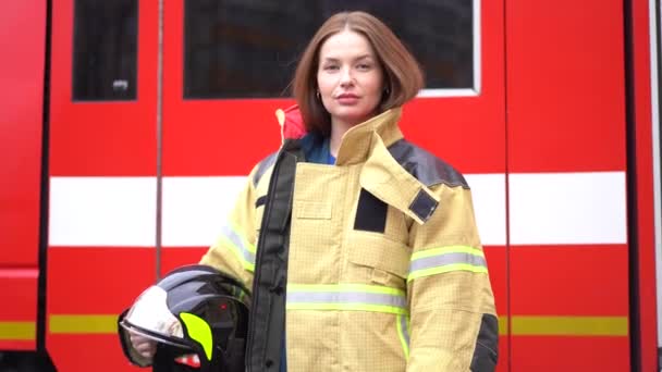 Lady in firefighter uniform with black protective helmet — Stock Video