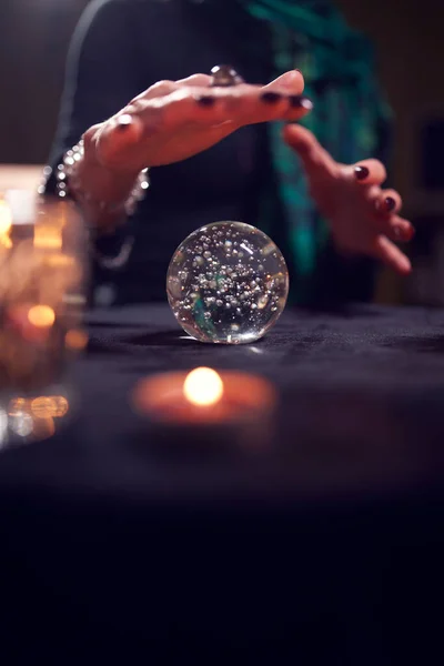 Close-up of female fortune-tellers hands with ball of predictions — Stock Photo, Image