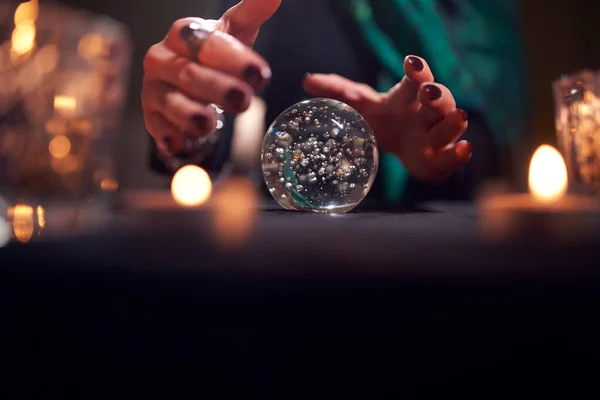 Hands of unrecognizable fortune-teller with ball of predictions — Stock Photo, Image