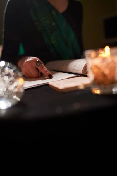 Close-up of fortune-tellers hands, predictions books, predictions ball — Stock Photo, Image