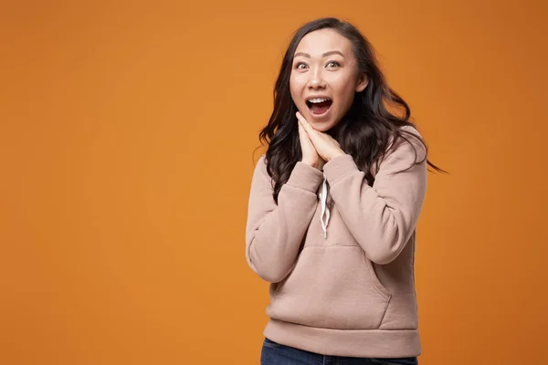 Happy brunette with long hair isolated in studio — Stock Photo, Image