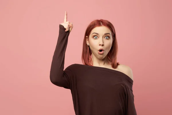 Surprised ginger girl with gray eyes with raised hand — Stock Photo, Image