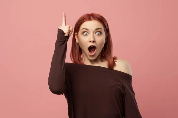 Surprised ginger woman with gray eyes with raised hand — Stock Photo, Image