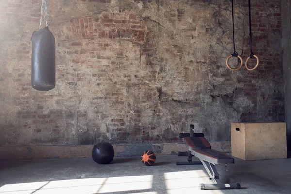 Gym with old brick wall with sports equipment — Stock Photo, Image