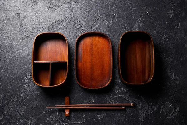 Open wooden bento box. with wooden sticks. — Stock Photo, Image