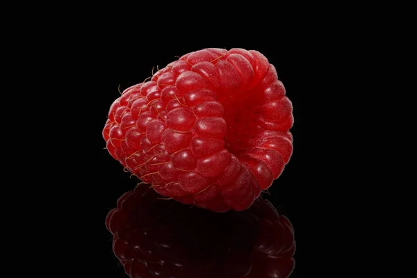 Ripe raspberries on a black background — Stock Photo, Image