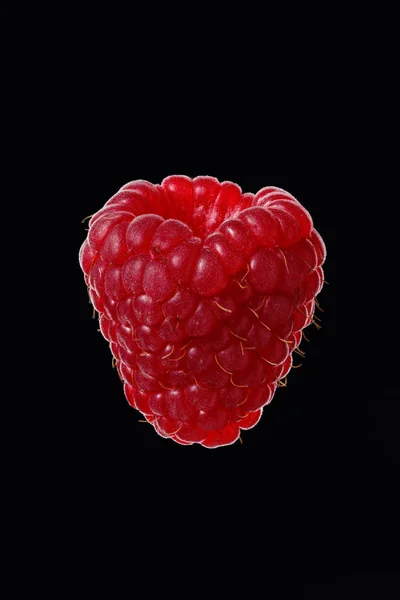 Ripe raspberries on a black background — Stock Photo, Image