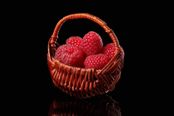 Basket with raspberries on a black background — Stock Photo, Image