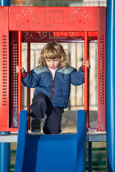 Adorable little boy playing on playground — Stock Photo, Image