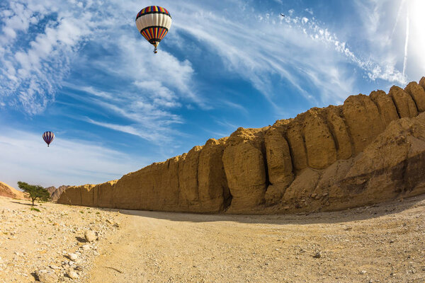 Balloon flying over desert