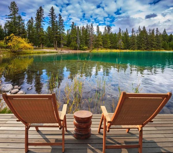 Two comfortable deck chairs on the lake — Stock Photo ...