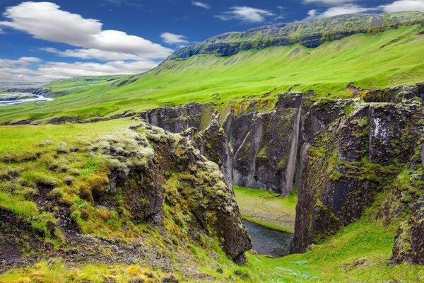 Landscape with cliffs canyon and strem