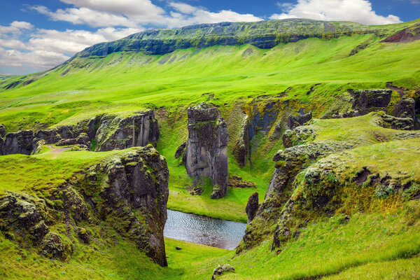 stream surrounded by cliffs 