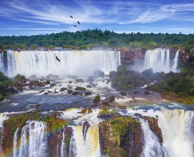 Magnificent waterfall Iguazu Falls in Park. The concept of active and cultural tourism clipart