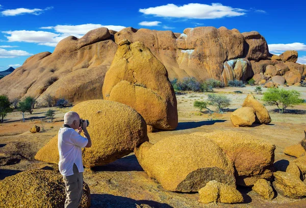 Rocks in the Spitskoppe desert. Travel to Africa. Picturesque cliffs in the desert Namib. The concept of active, extreme and photo-tourism