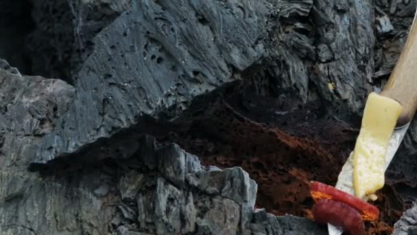 Barbecue on fire in the crack in the frozen lava flow resulting from eruption Flat Tolbachik in 2012 — Stock Video