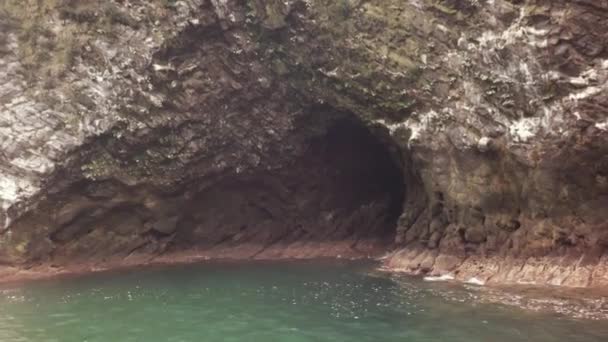 Caves in the south-eastern coast of Kamchatka peninsula is washed by waters of Pacific Ocean stock footage video — Stock Video