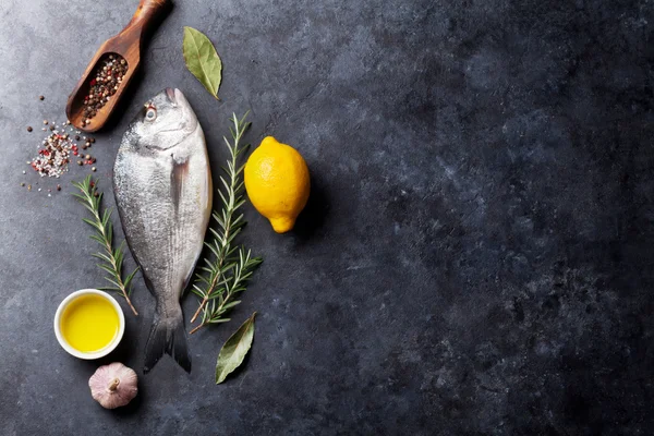 Raw fish with ingredients — Stock Photo, Image