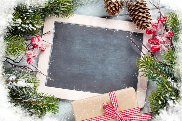 Christmas fir tree and chalkboard — Stock Photo, Image