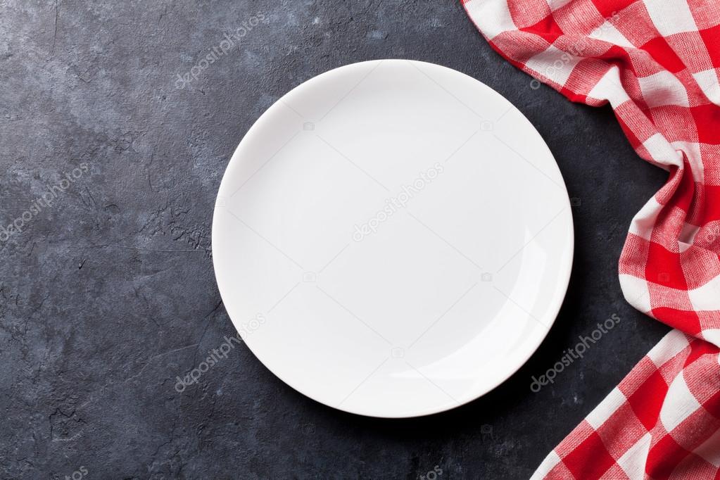 Empty plate and kitchen towel