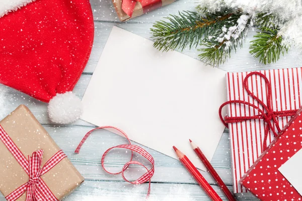 Tarjeta de felicitación de Navidad y cajas de regalo —  Fotos de Stock