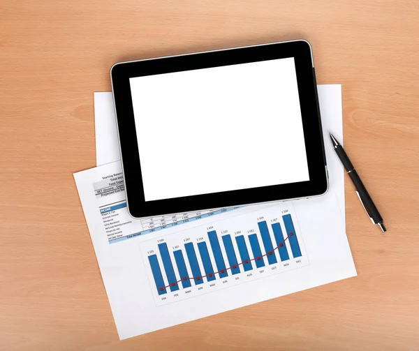 Tablet with blank screen over papers — Stock Photo, Image