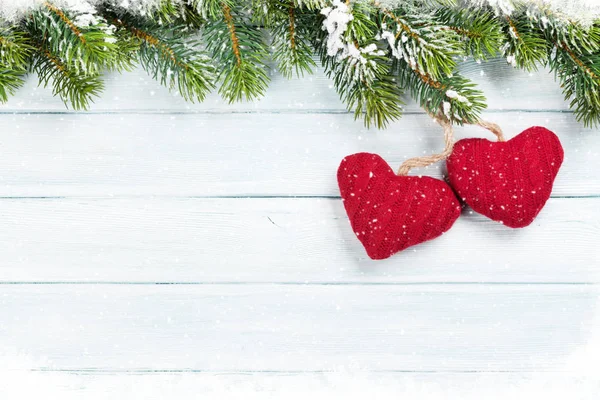 Snow fir tree and two hearts — Stock Photo, Image