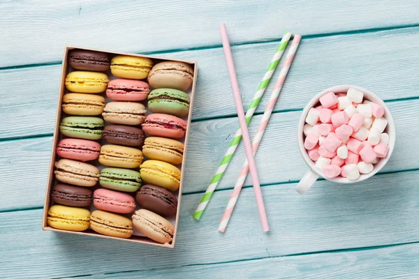 macaroons in gift box and cup with marshmallows