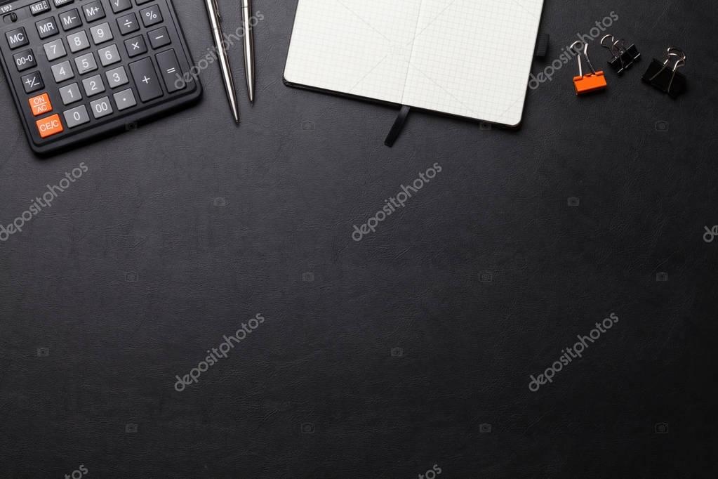 Office desk table with office stuff Stock Photo by ©karandaev 129772320