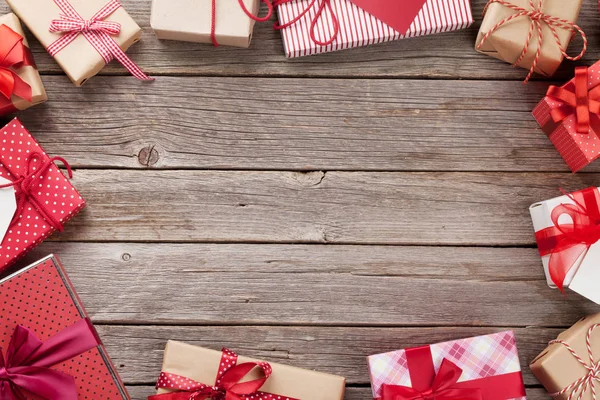 Gift boxes on wooden background — Stock Photo, Image