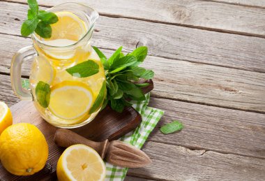 Lemonade with lemon, mint and ice clipart