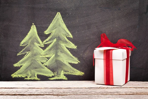 Christmas gift and hand drawn xmas fir trees