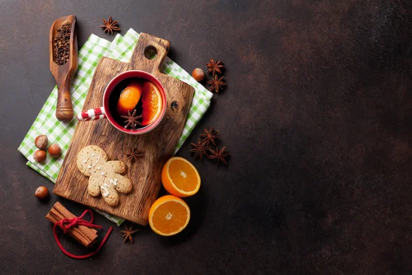 Cup of mulled wine with ingredients — Stock Photo, Image