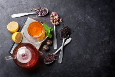 Tea cup and assortment of dry tea