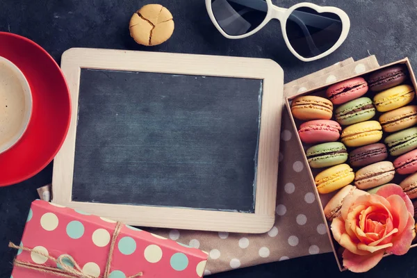 Colorful macaroons in pink box