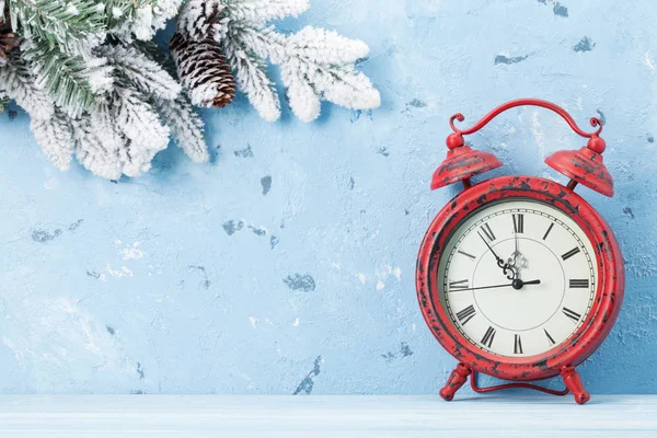 Christmas alarm clock and fir tree — Stock Photo, Image