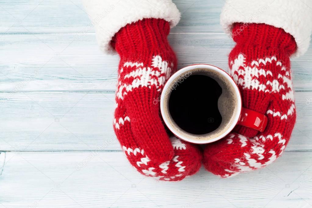 Female hands holding hot coffee