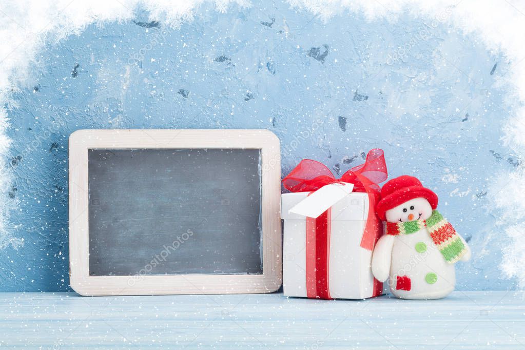 Christmas chalkboard, snowman and gift box