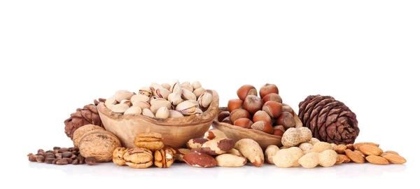 Various nuts in wooden bowls — Stock Photo, Image