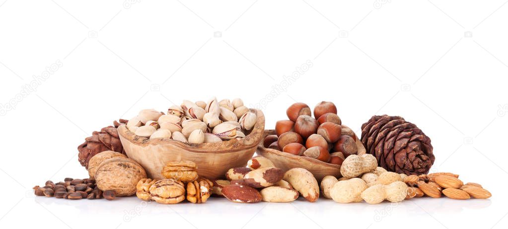 Various nuts in wooden bowls