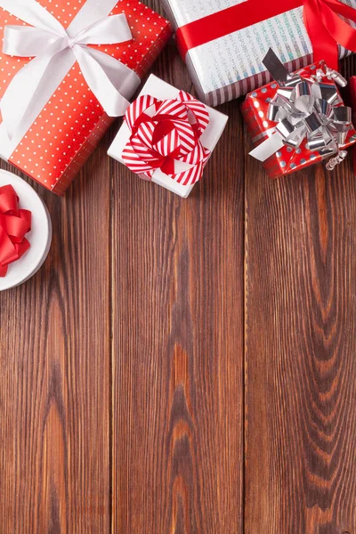 Gift boxes on wooden table — Stock Photo, Image